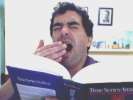 Joel with textbook, yawning