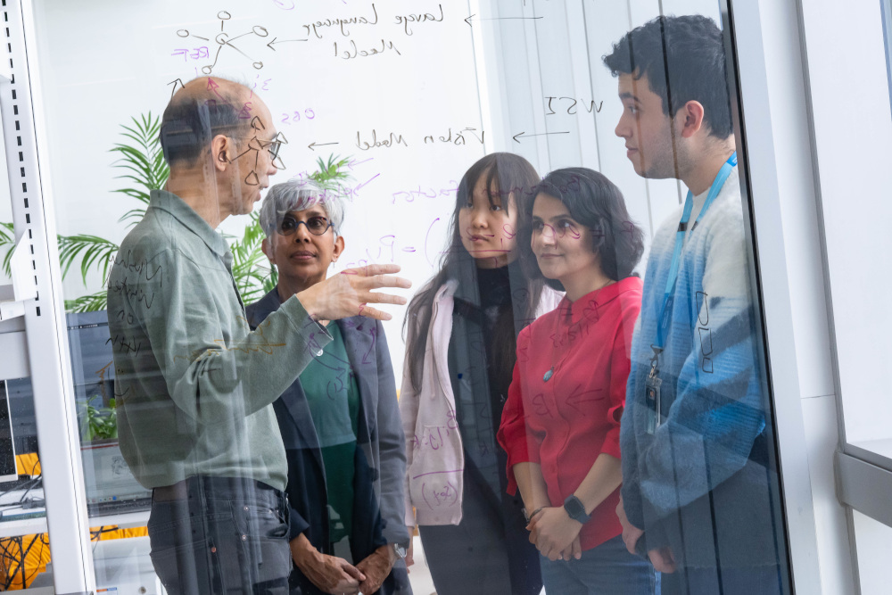 Drs. Ng and Palepu with graduate students and post-doctoral fellows