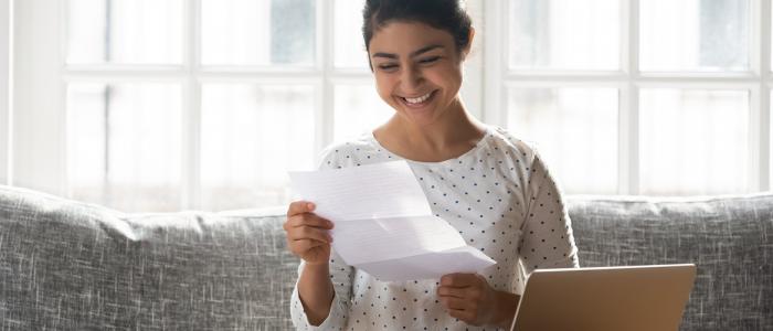 Woman opening letter