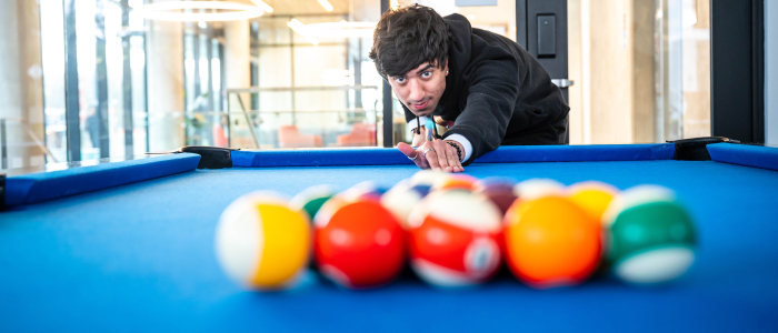 Student playing pool