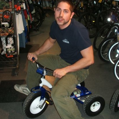 Mike Lawrence on a tricycle.