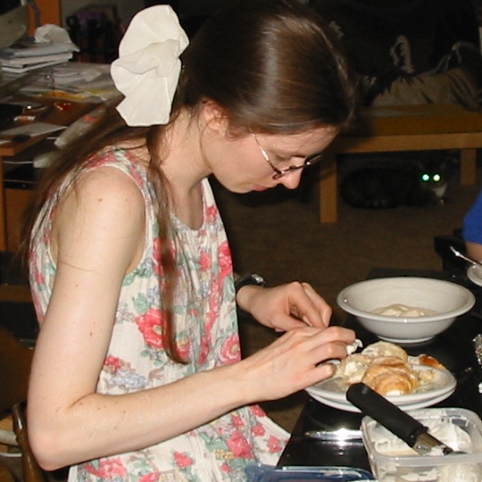 Rachel inspects the ring in the pastry